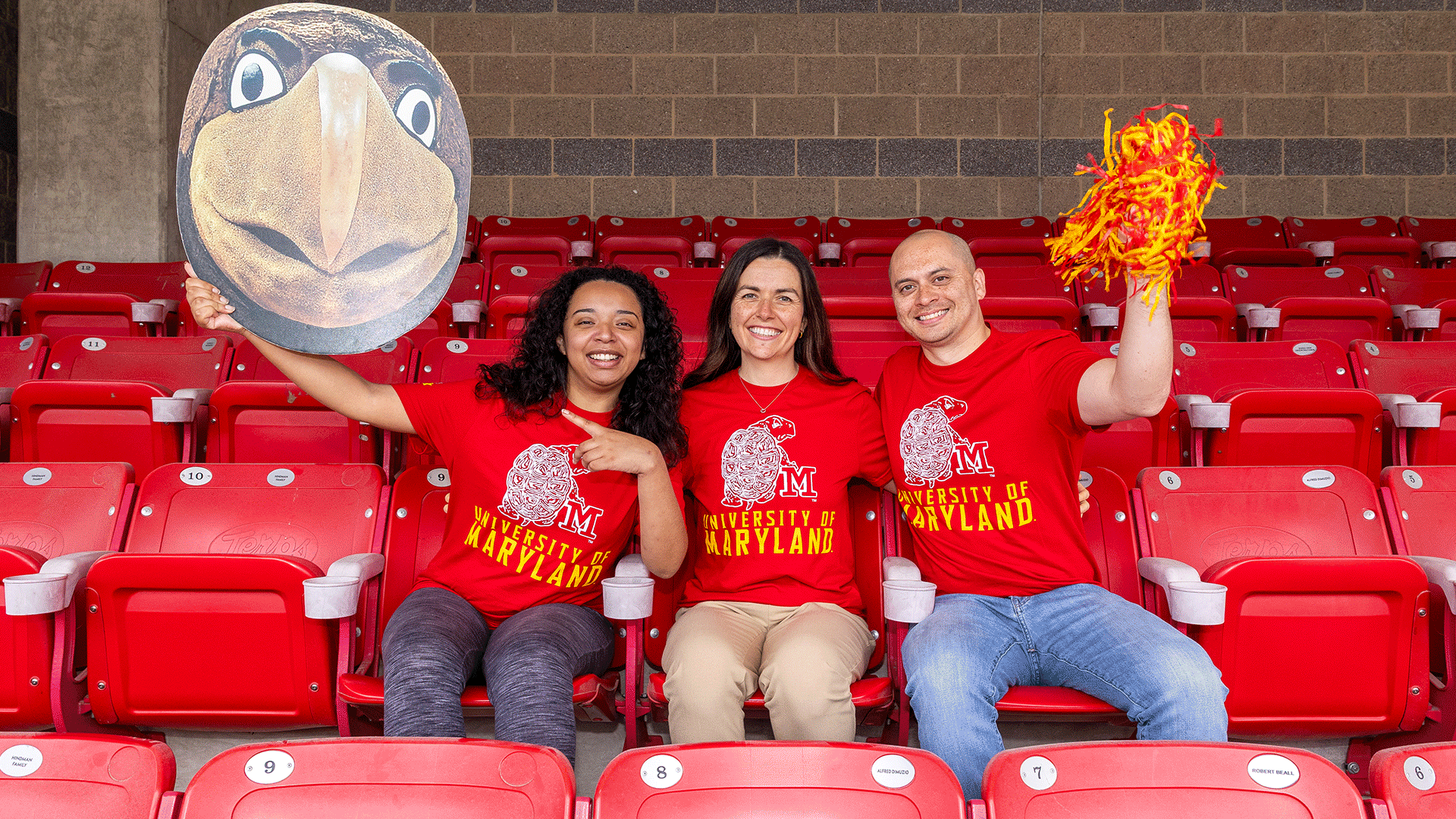 A series of phots that showcase the 2025 limited edition Homecoming shirt, a red t-shirt that features a vintage logo mark of Testudo, the UMD mascot.